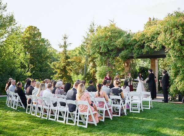 Guests attending a wedding in the Red Butte Garden Rose Garden