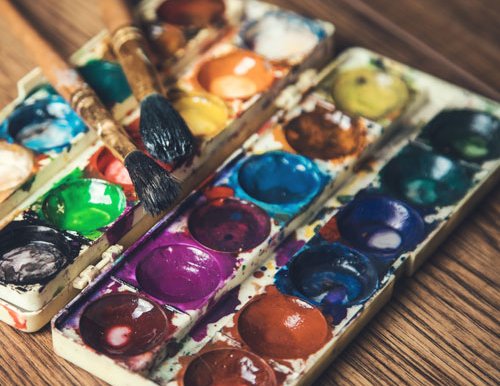 Watercolor paint set with paintbrushes